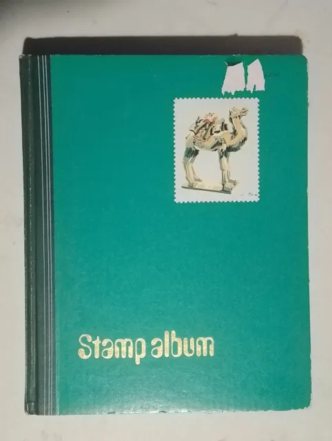 Stamp Album Containing GB And Worldwide Stamps  Album a bit tatty but intact