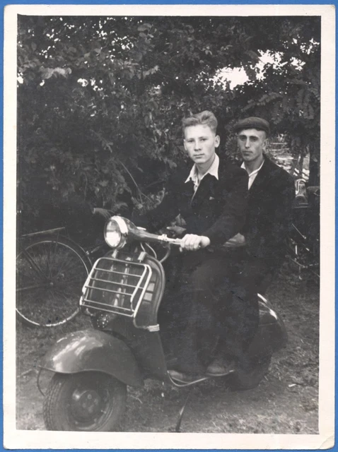 Two handsome guys on an old motor scooter Vintage photo