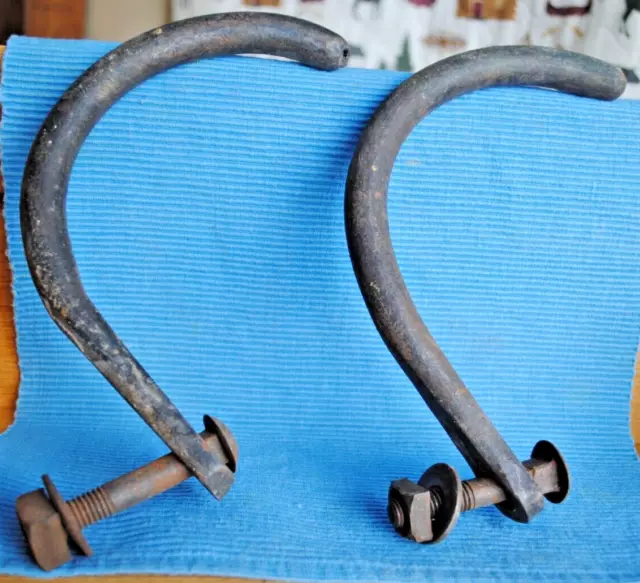 Very old wrought iron curved cradles with bolts / maybe railroad related 2