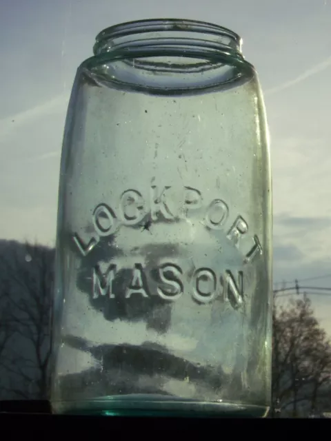 1 qt. blue lock port Mason canning jar & a zinc lid. pebble molded into glass