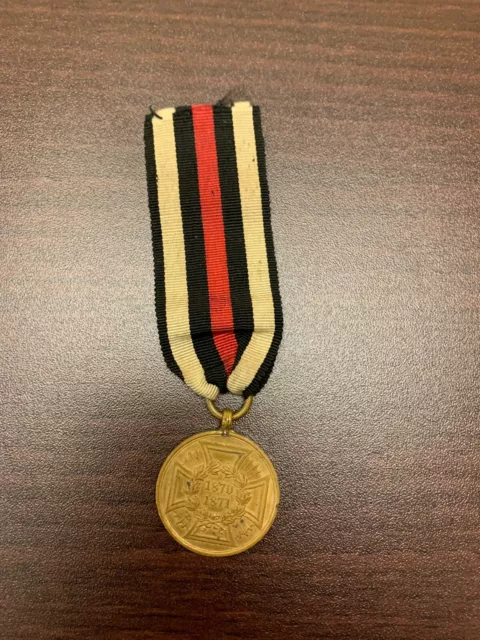 Medaille Orden Kriegsdenkmünze für Kämpfer 1870/1871 mit Bandstück Militaria