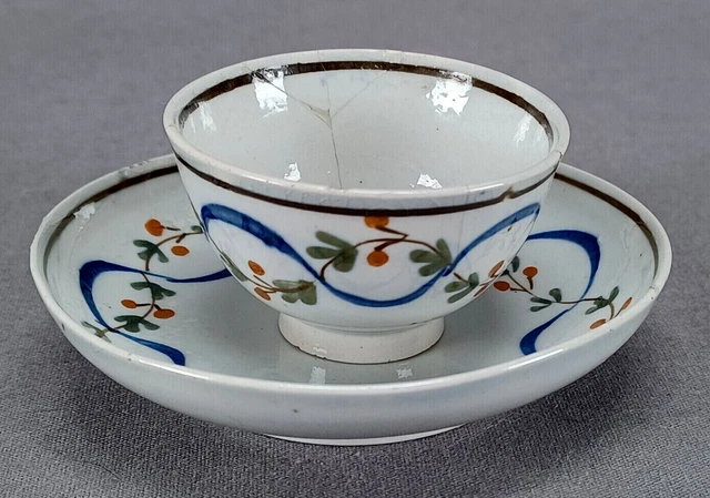 British Enamelled Ocher Berry & Blue Ribbon Child's Pearlware Tea Bowl & Saucer