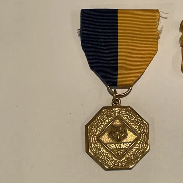 Vintage Cub Scouts activity medal 1980s with blue yellow ribbon