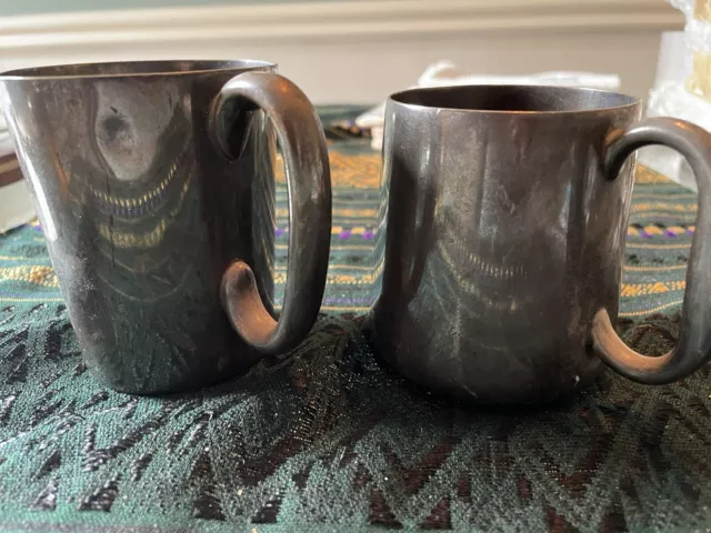 A Pair Of NPS SILVER Vintage tankards