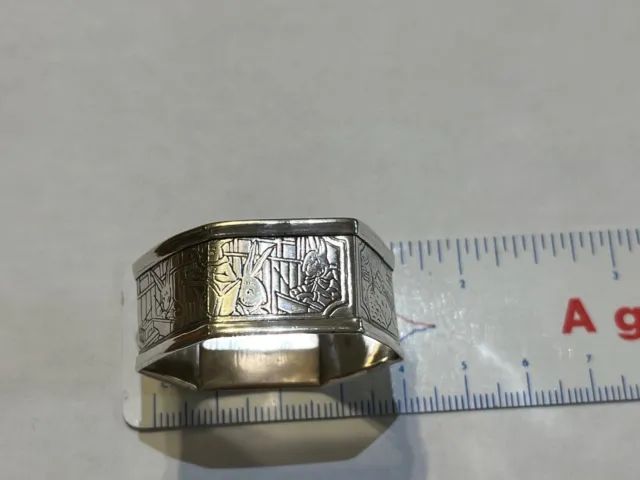 Child's sterling silver octagonal napkin ring with rabbit engraving on side
