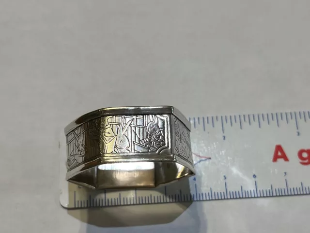 Child's sterling silver octagonal napkin ring with rabbit engraving on side
