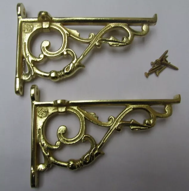 PAIR OF SMALL LIPPED BRASS cast iron ornate shelf support wall brackets