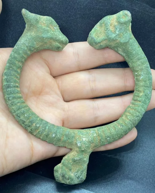 Ancient luristan bronze wrist torq with twin ram heads superb