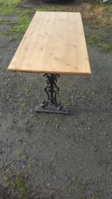 Wooden top table with cast iron legs