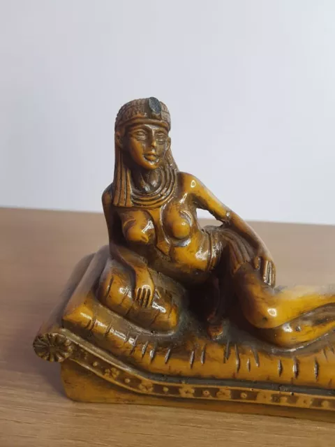 Beautiful Queen Cleopatra Statue sitting on her throne from antique Stone