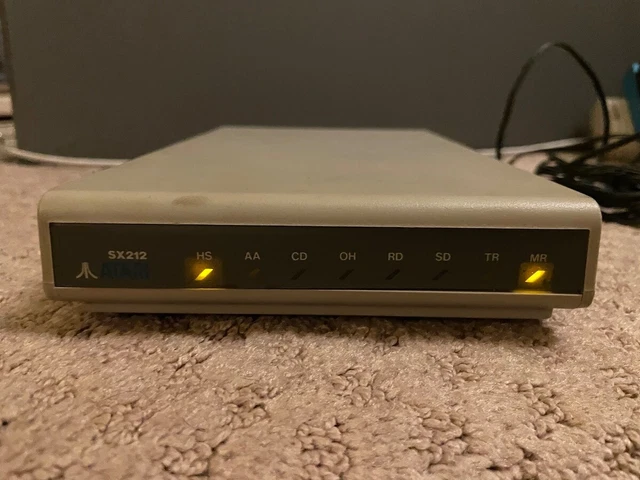 Atari SX212 Modem 1987 w/ Power Adapter, Manual, Peripheral Cable powers on