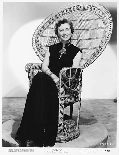 actress Valentina Cortese sitting in a wicker chair, wearing a - Old Photo