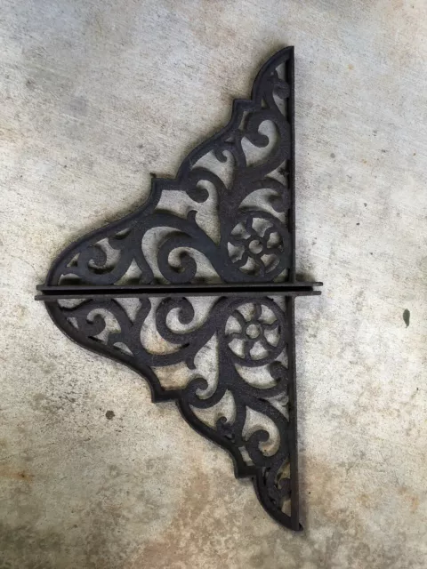 Pair Of Rusty Cast Iron Ornate Brackets