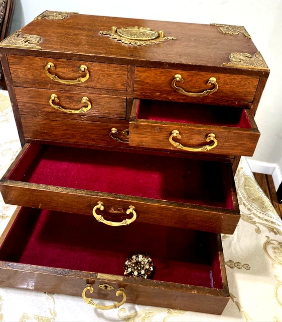 Antique Chinese 7 Drawer Jewerly Chest With brass handles and ornament mounted.