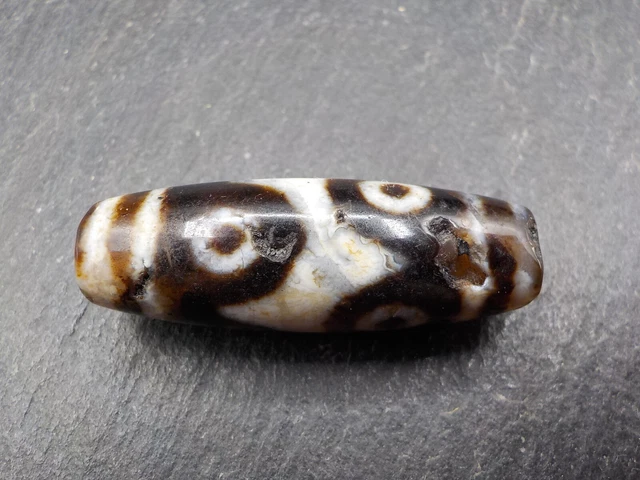 An Agate Dzi bead with a 6 Eye pattern from Tibet / Nepal.