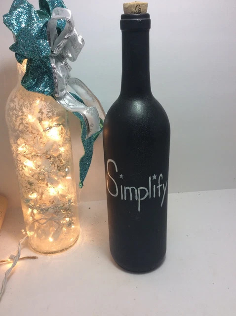 Botella de vidrio pintada a mano simplificar