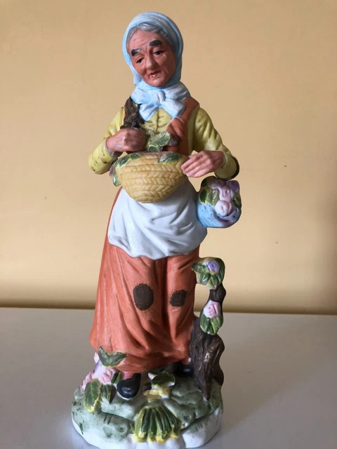 VTG Ceramic Figurine Elderly women carrying basket with flowers 13"