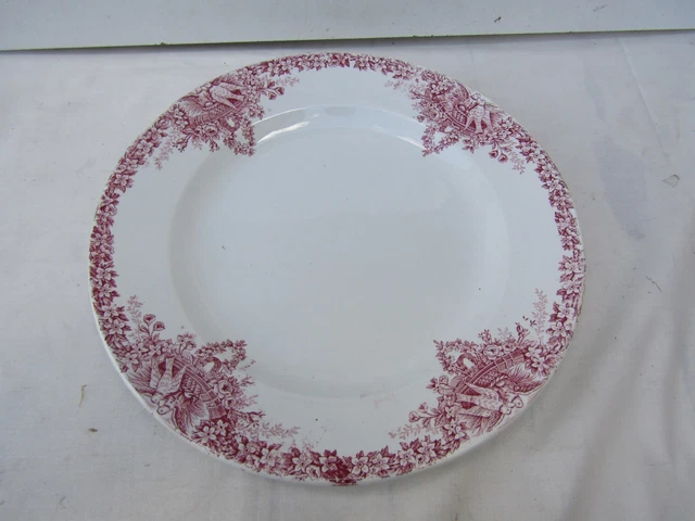 plat rond en  terre de fer saint amand colombier  33 cm de diametre