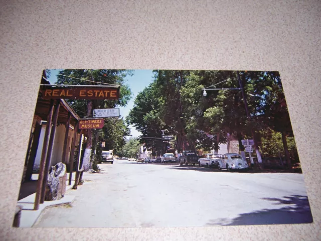 1960s MAIN STREET SCENE, MURPHYS CA. VTG POSTCARD