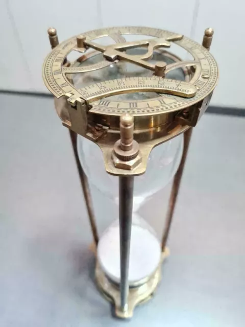 vintage maritime brass sand timer hourglass with sundial compass on top