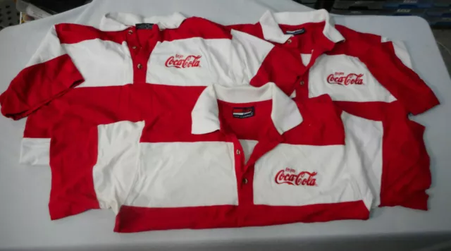 #Ll3.   Three(3)  Medium-Sized  Coca Cola  Tops