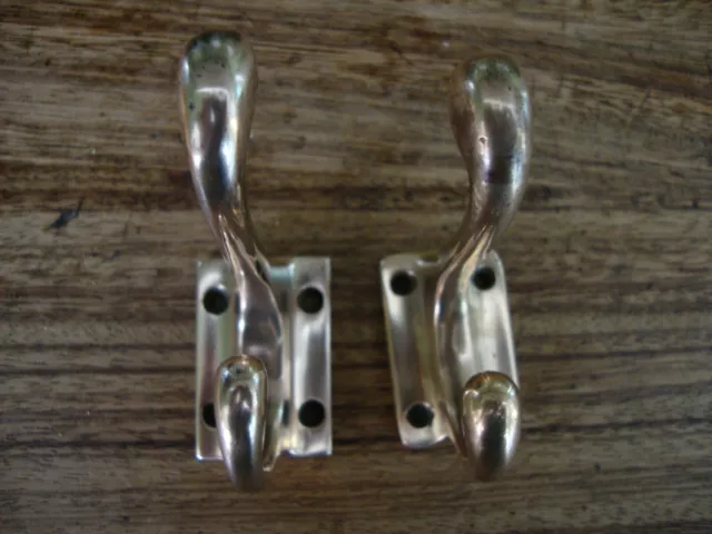Antique matched pair bronze/ rose brass coat hooks
