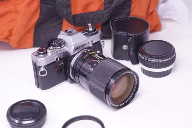 VINTAGE OLYMPUS OM10 SLR FILM CAMERA WITH Soligor 28-80mm lenses
