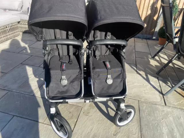 Black Bugaboo Donkey, two toddler seats and carrycot 