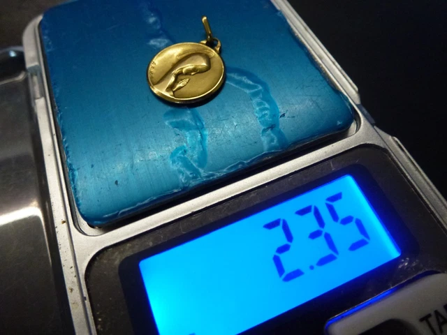 clef de montre et sa chainette en or poincon tete d'aigle,P 8,10g au