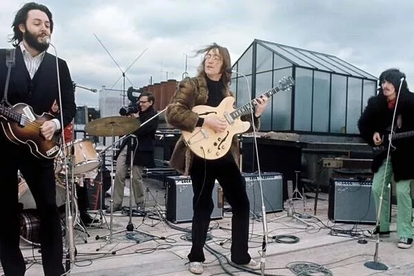 The Beatles perform on London rooftop 1969 Paul John George 24x36 poster