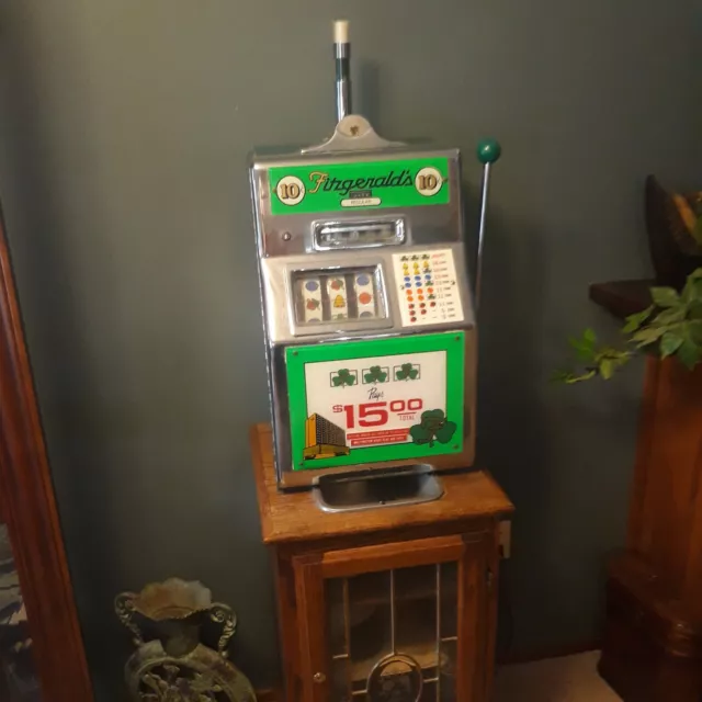 Fitzgerald's 10 cent slot machine with cabinet vintage Fitzgerald's 10 cent slot machine with cabinet vintage