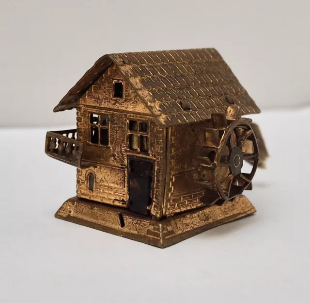 Antique miniature brass water mill with tape measure, 19th C,  4cm x 4cm