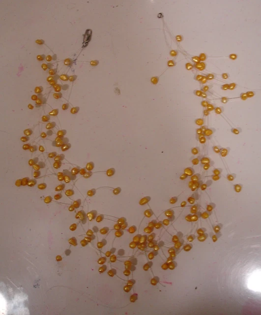 Yellow pearl necklace seed pearls on plastic cord 16 inches