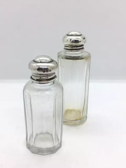 Pair of solid sterling silver topped glass scent dressing table vanity bottles