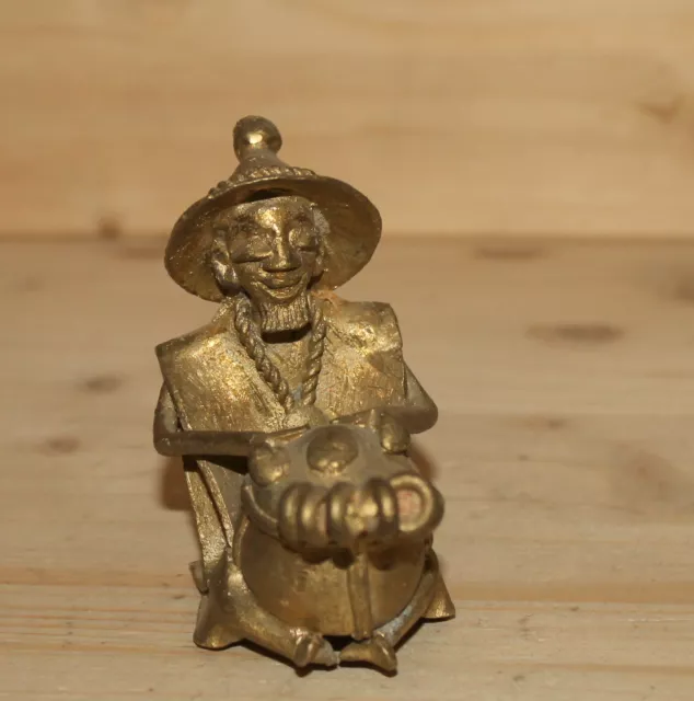 Vintage hand made bronze figurine African man play on drum