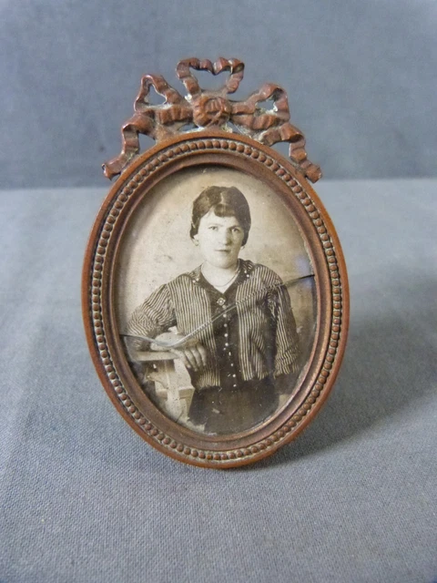 Small Louis XVI style bronze and curved glass photo frame with antique photo