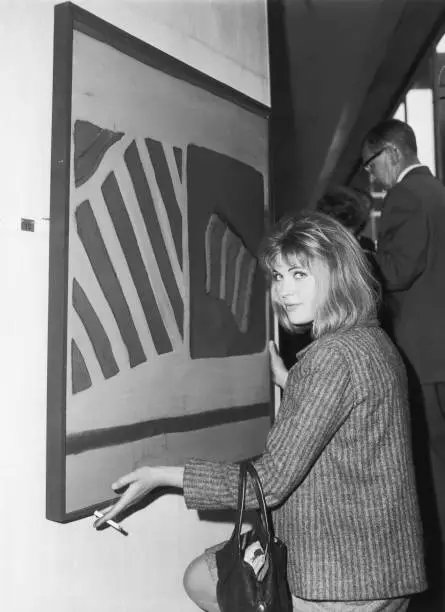 British pop artist Pauline Boty hangs one works entitled 'Paint- 1962 Old Photo