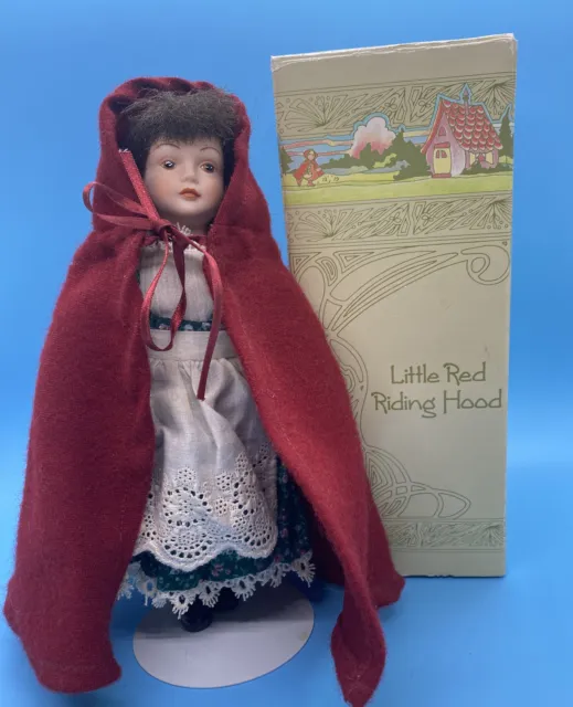 Avon 1985 Fairy Tale Collection “Little Red Riding Hood porcelain 8”doll w/stand