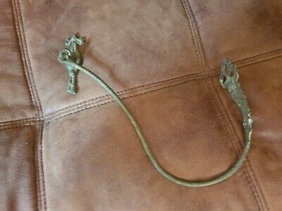 One Old french ornate brass curtain tie back approx 34cms overall length