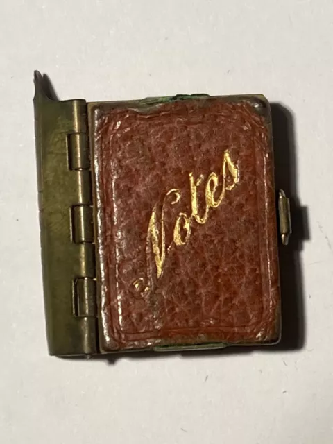antique tiny notebook circa early 1900s brass leather and paper intruiging rare