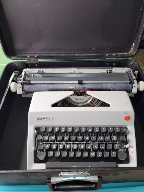 Máquina de escribir Olympia De Luxe 1976 para viajeros con instrucciones, accesorios y estuche