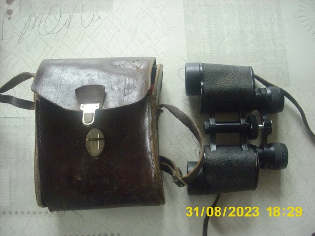Paire de  jumelles anciennes  COLMONT Paris avec étui en cuir