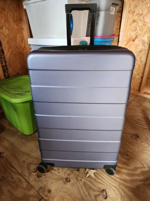 Large blue hard case rolling suitcase, everything is in working condition