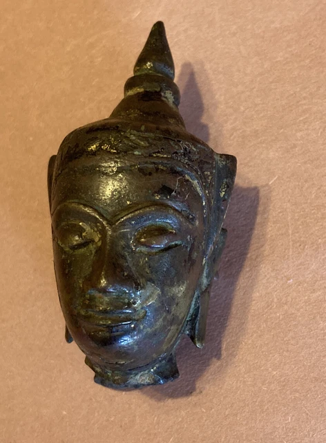 Fine antique Burmese bronze Buddha head, hardwood stand