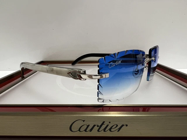 cartier white buffs blue lenses