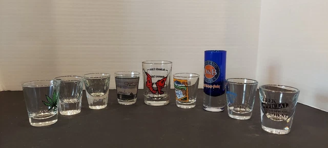 9 Shot Glasses Mixed Lot In Good Condition Pot Leaf, Cajun, D&B, Stubbs Etc.
