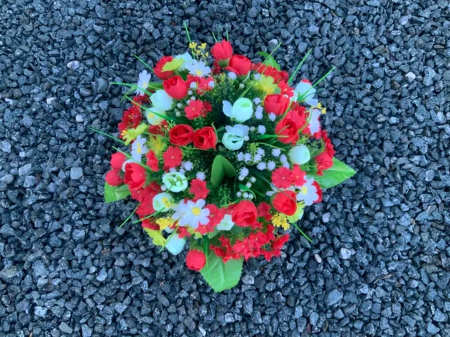 Artificial flower arrangements in grave memorial cemetery pots various colours