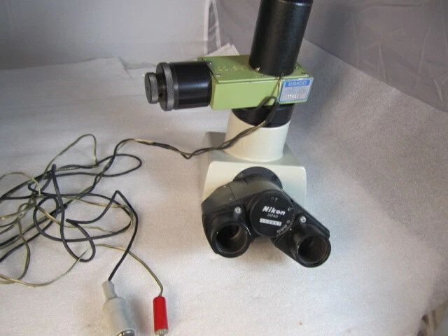 Nikon trinocular head model T, accepts 23mm eyepiecesw/ Lasico Filar eyepiece
