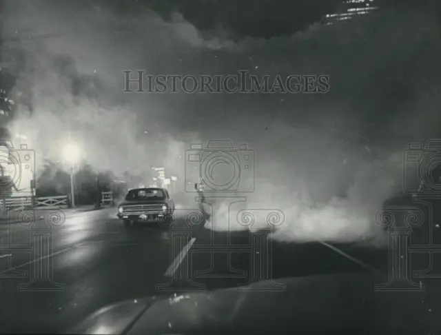 1964 Press Photo Car driving in fog of spray to kill mosquitoes in Houston area