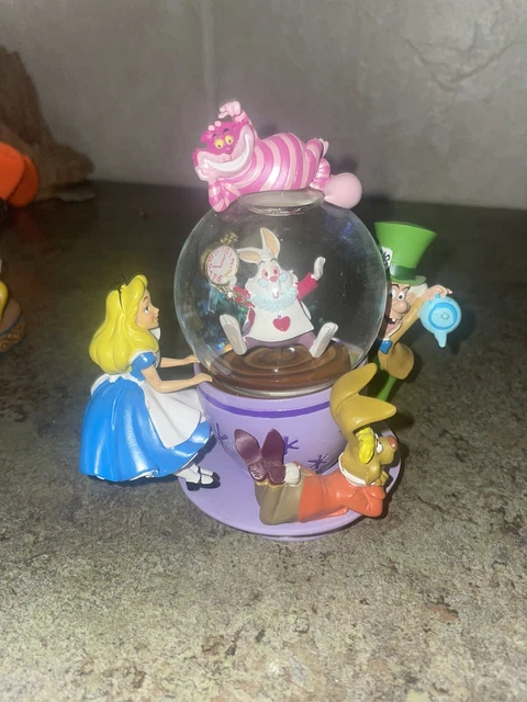 Disney Parks Alice in Wonderland Snow Globe Spinning Tea Cup Collectible Disney Parks Alice in Wonderland Snow Globe Spinning Tea Cup Collectible